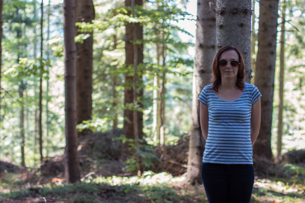 istock Girl in a forest 1000845456