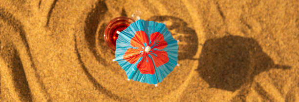 istock colorful shots drinks on a sandy beach with umbrellas for drinks 1000846158
