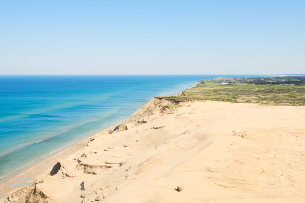 istock Arial view of rugged coastline in bright sunlight. Rubjerg Knude, Denmark 1000850148