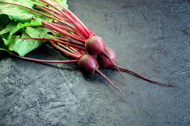 istock Fresh Ripe Beet on Dark Background. Organic Food. Copy Space For Your Text 1000854114