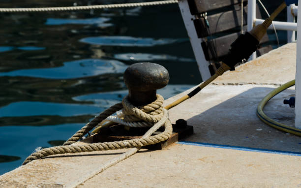 istock mooring post on the waterfront in a small marina, element for mooring ships in the harbor 1000856992