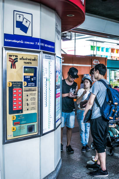 Bangkok, Thailand - May 01 2018:  Ticket machines at a BTS Skytrain station.  Commuters pay money to receive automated tickets.  Bangkok has an excellent public transportation system that keeps the city flowing day and night.