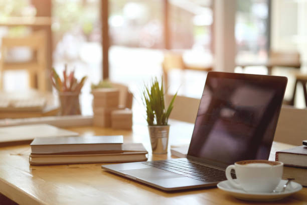 istock Mockup laptop comfortable work table and office supplies in office. 1000862634