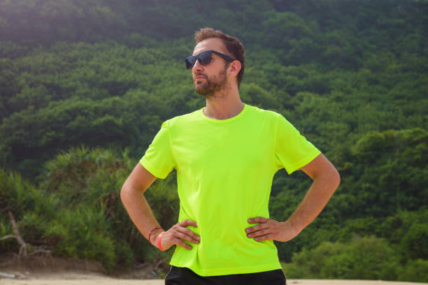 Exercising on a tropical sandy beach near sea / ocean.