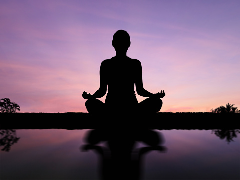 Woman silhouette standing, practicing yoga. Om, harmony concept, person meditating at sunrise, front view wide shot