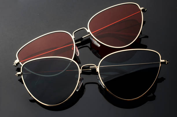 istock sunglasses cat's eye in metal frame isolated on black 1000878520