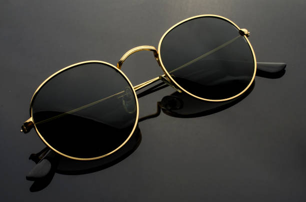 istock round sunglasses isolated on black 1000880624