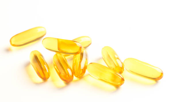istock fish oil capsules isolated on white background 1000898648