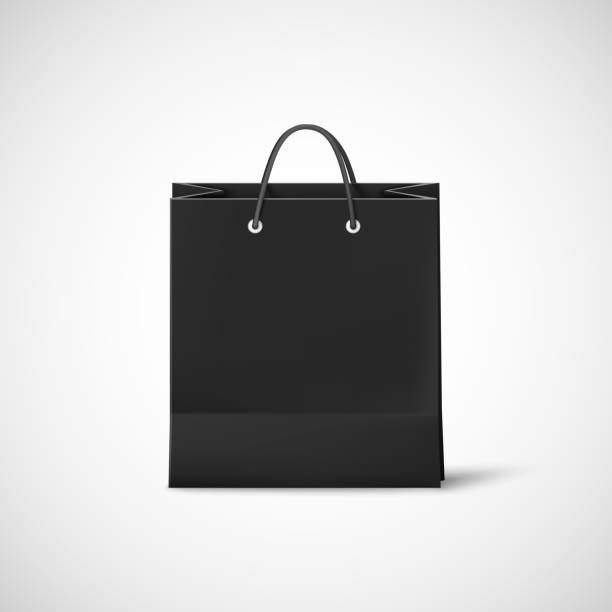 istock Black shopping paper bag. Template of empty black cardboard bag. Vector illustration isolated on white background 1000911522