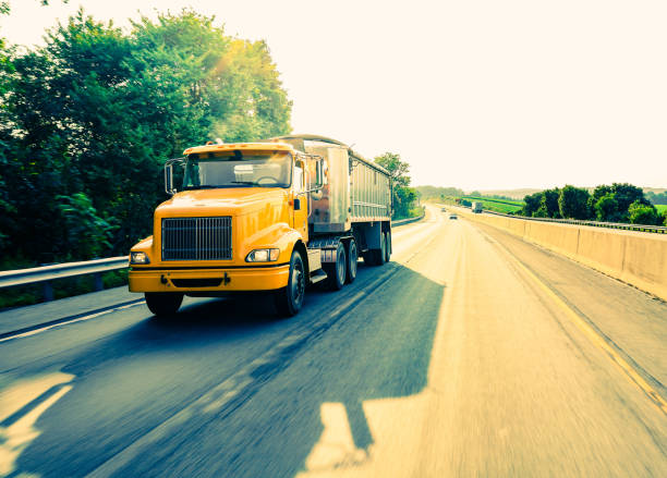 istock 18 wheeler dump truck on the road 1000915134