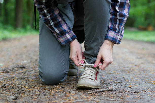 istock Woman wearing hiking boots on footpath 1000951790