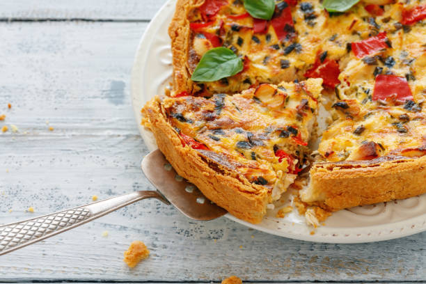 istock Quiche with chicken, onion and red sweet pepper. 1000958612