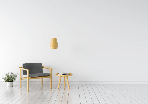 istock grey armchair in white room, 3D rendering 1000962758