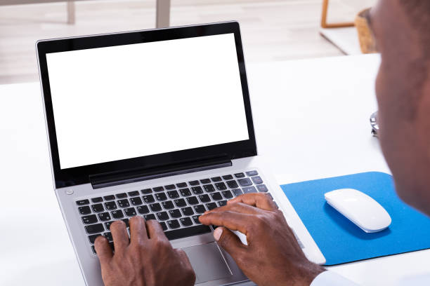istock Close-up Of Man Using Laptop 1000962924