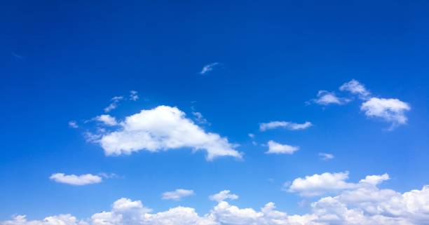istock White clouds disappear in the hot sun on blue sky. Clouds on blue sky background. Weather nature blue sky with white cloud and sun. 1000963572