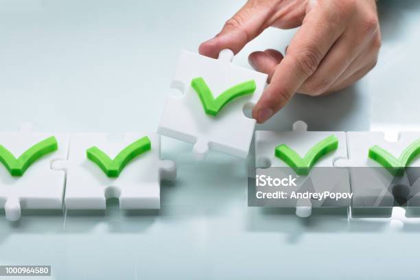 Person Arranging Check Mark Sign In A Row Stock Photo - Download Image Now - Choosing, Success, Accuracy