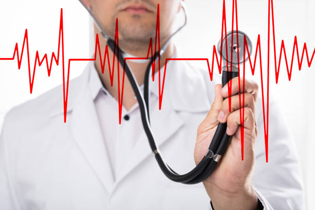 istock Doctor examining heart rate with stethoscope 1000967106