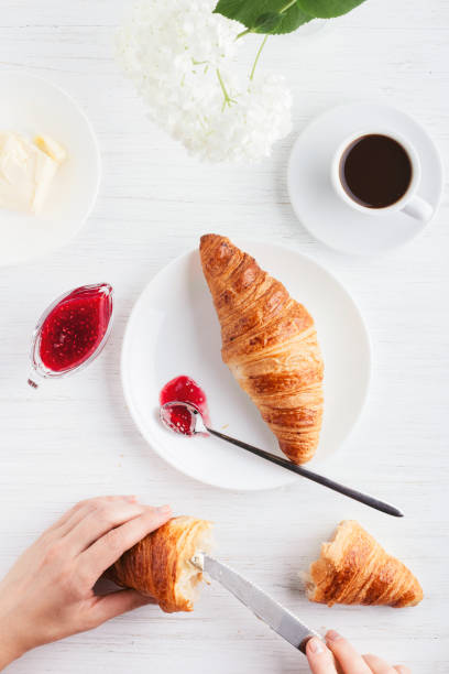 istock Coffee and croissants on the table. 1000973388