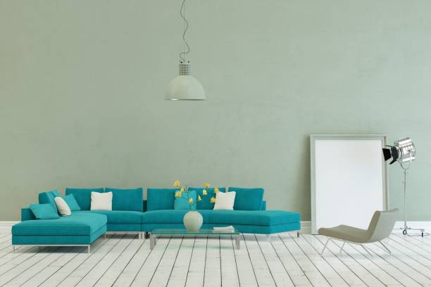 istock Blue sofa in modern scandinavian design with grey wall 1000975586