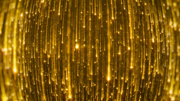 istock 3D rendering of the falling of bright particles. Starfall on a dark background with shiny and glowing asterisks 1000978724