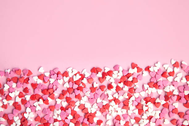 istock pink background and many sugar red,pink hearts 1000981302