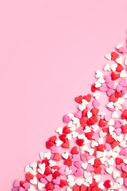 istock pink background and many sugar red,pink hearts 1000981306