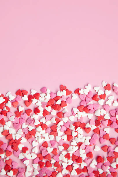 istock pink background and many sugar red,pink hearts 1000981376