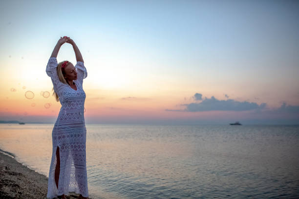 Enjoying in a beautiful sunset by the sea