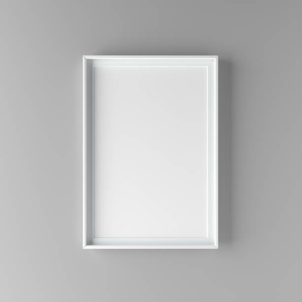 istock Elegant and minimalistic picture frame standing on gray wall 1000994628