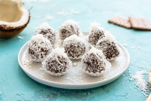 istock Sweet coconut candies on the concrete blue table 1000996800