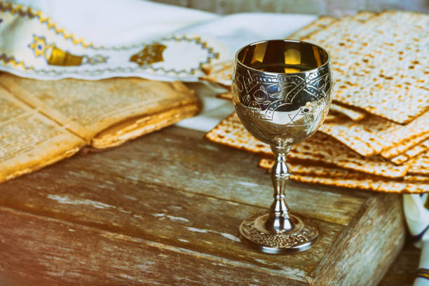 istock Passover holiday with wine and matzoh over rustic background with copy space 1000997070