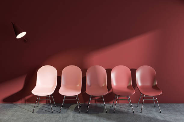 istock Row of red chairs in red wall room 1001000174