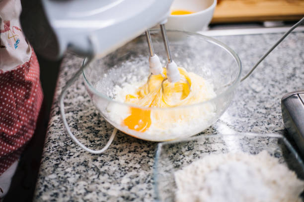istock Young woman holding bowl with dough and whisk 1001000348