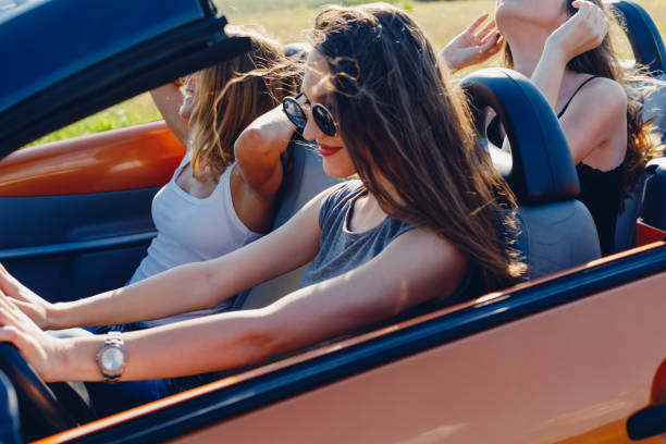 istock Young women on a road trip with cabriolet 1001001752