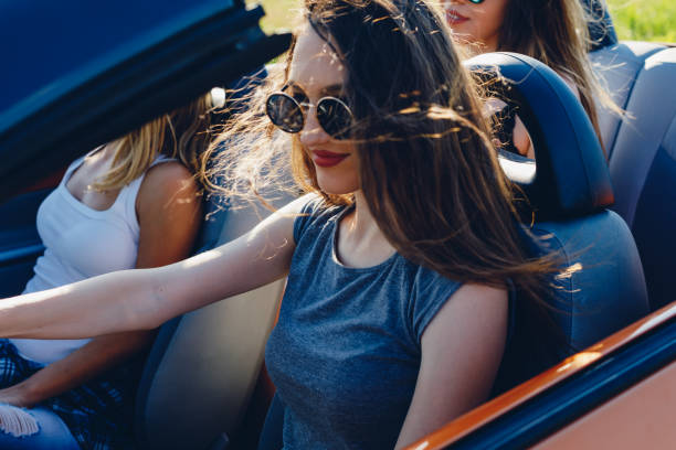 istock Young women on a road trip with cabriolet 1001001986
