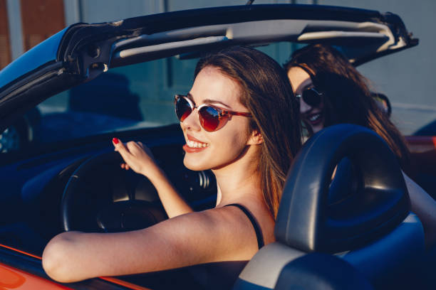 istock Young women on a road trip with cabriolet 1001002568