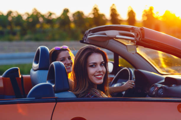 istock Young women on a road trip with cabriolet 1001007010