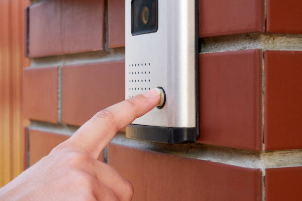 istock The female hand presses a button doorbell with camera and intercom 1001013712