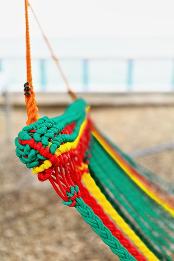 Colourful hammock hanging on the shore of Oslob municipality facing the coastal area where tourists go to watch whale sharks and snorkel among them which is so invasive. Oslob-Cebu island-Philippines.