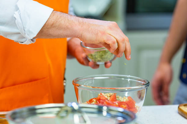 istock kitchen Preparation: the chef prepares a salad 1001025282