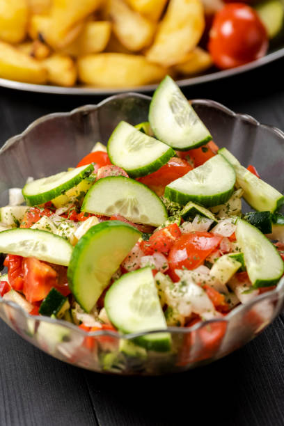 istock bowl with vegetable salad on a wooden table 1001057944