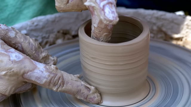 Potter's Hands Work with Clay on a Potter's Wheel. Slow Motion