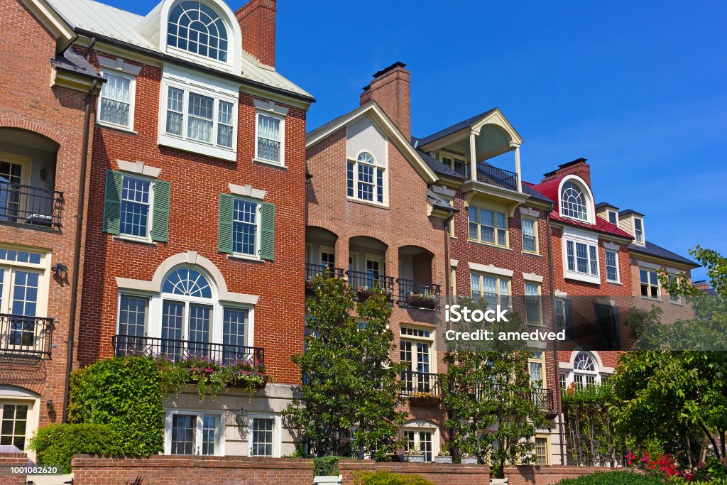 Modern houses facing Old Town Alexandria waterfront in Virginia, USA. Highly sought after residential development in Alexandria neighborhood. Virginia - US State Stock Photo Modern houses facing Old Town Alexandria waterfront in Virginia, USA. Highly sought after residential development in Alexandria neighborhood. Virginia - US State Stock Photo