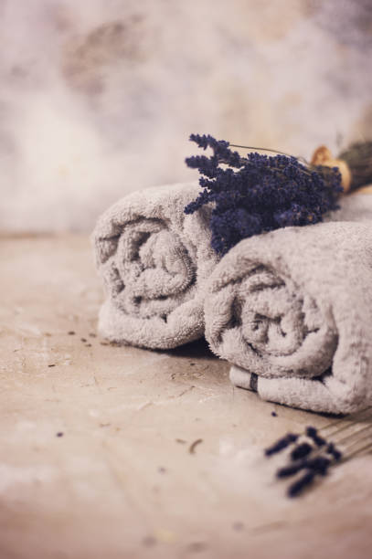 istock Spa concept, towels with lavender flowers 1001107478
