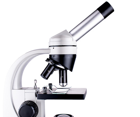 Isolated microscope part closeup on white background