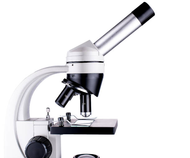 Microscope top part closeup, white background isolated Isolated microscope part closeup on white background microscope isolated stock pictures, royalty-free photos & images