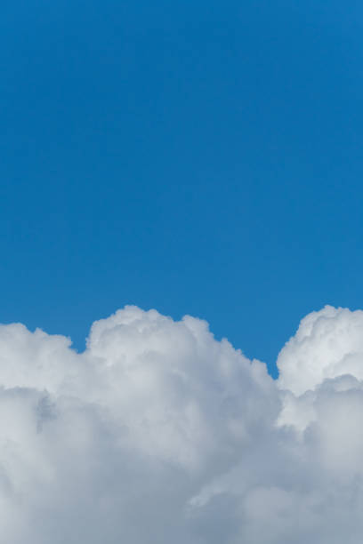 istock Lush massive white clouds against the background of the endless blue sky 1001114332