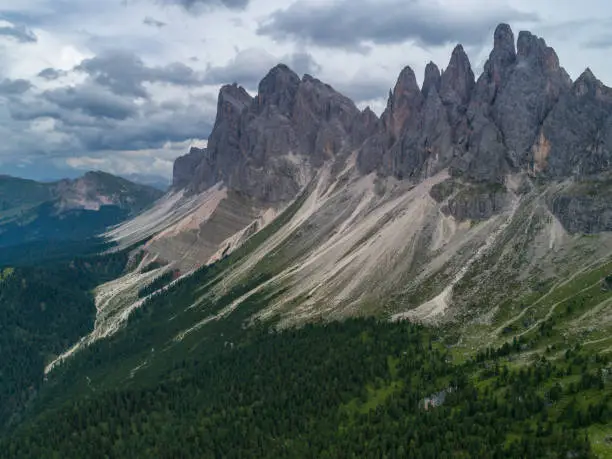 Photo of Aerial Drone photo of Santa Magdalena St Maddalena Val di Funes in Dolomites Italian Alps with Furchetta mountain peak on the background