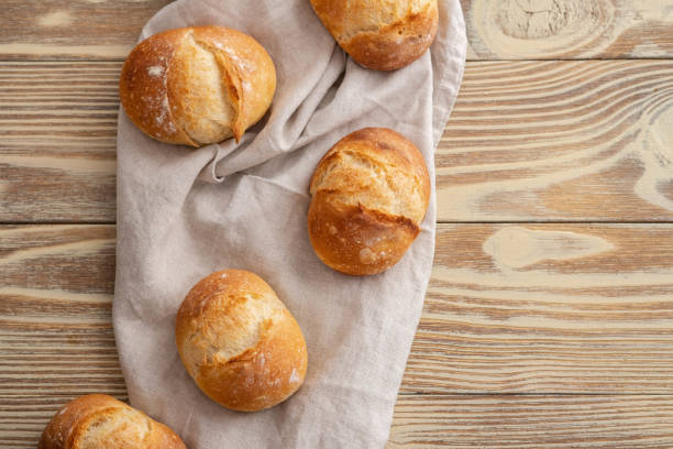 istock Assortment of baked bread on wooden table background. Copy space. 1001114808