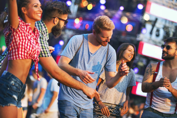 istock Friends dancing at a concert. 1001117404